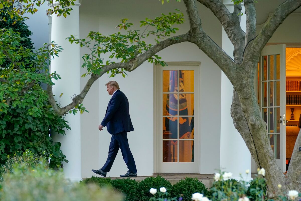 President Donald Trump leaves the Oval Office
