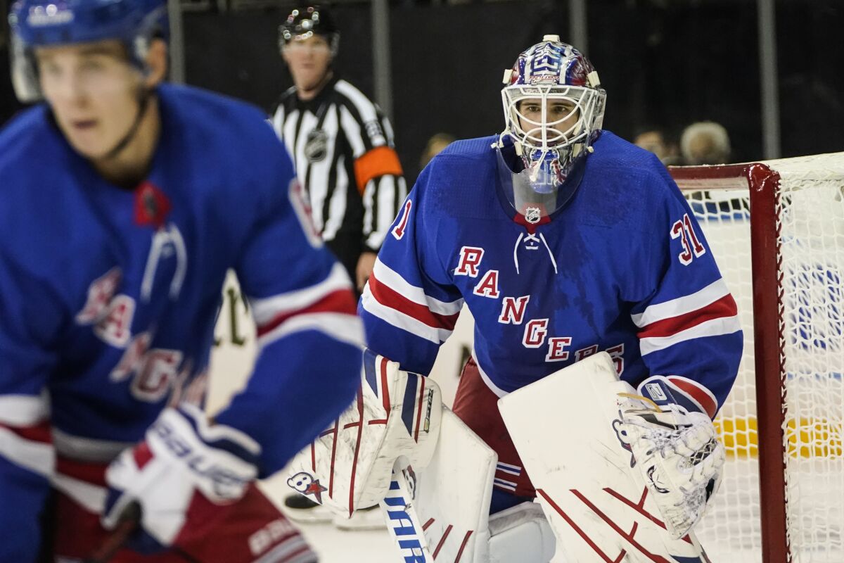 New York Rangers goaltender Igor Shesterkin (31) protects the net during the third period of the team's NHL preseason hockey game against the New Jersey Devils on Wednesday, Oct. 6, 2021, in New York. (AP Photo/Frank Franklin II)