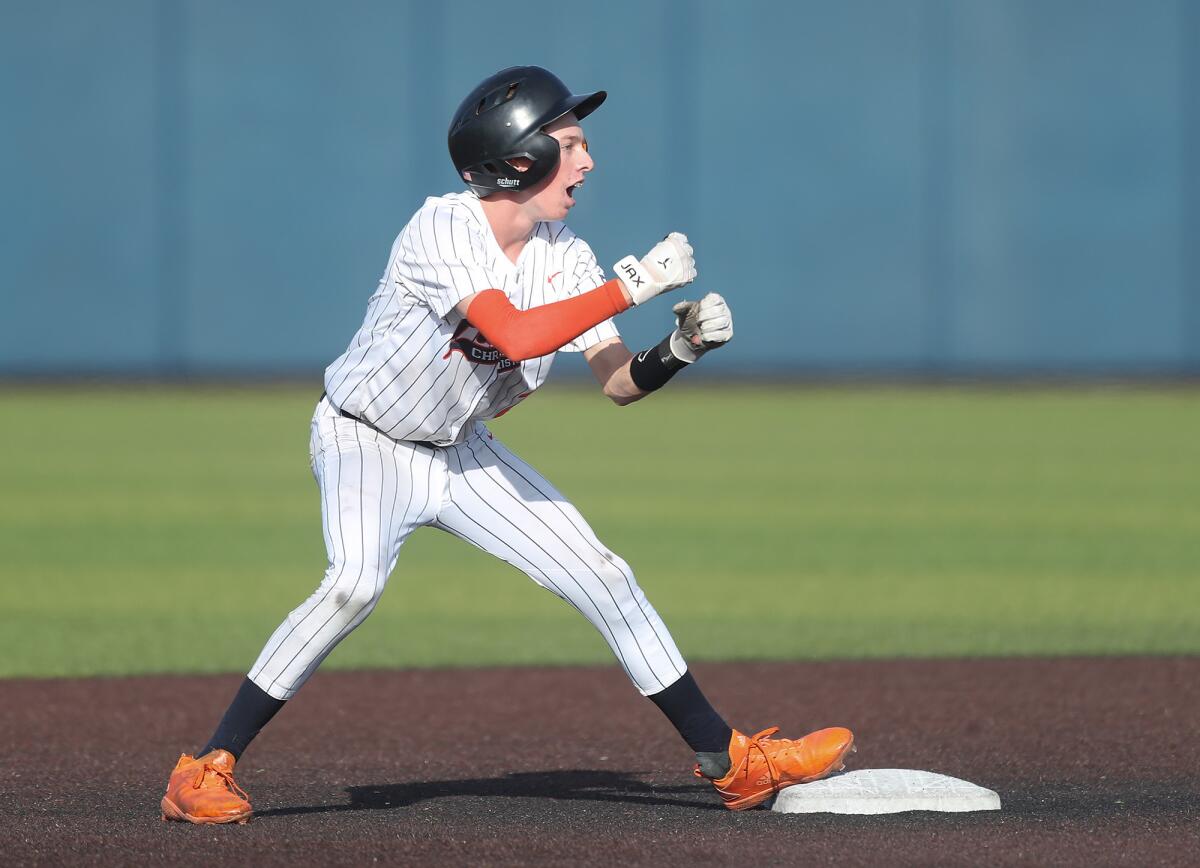 Pacifica Christian's Blake Hayes (2) holds on at second base after hitting a double against San Bernardino on Tuesday.