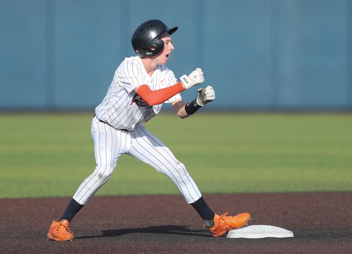 Pacifica Christian's Blake Hayes (2) holds up at second base after hitting a double against San Bernardino on Tuesday.