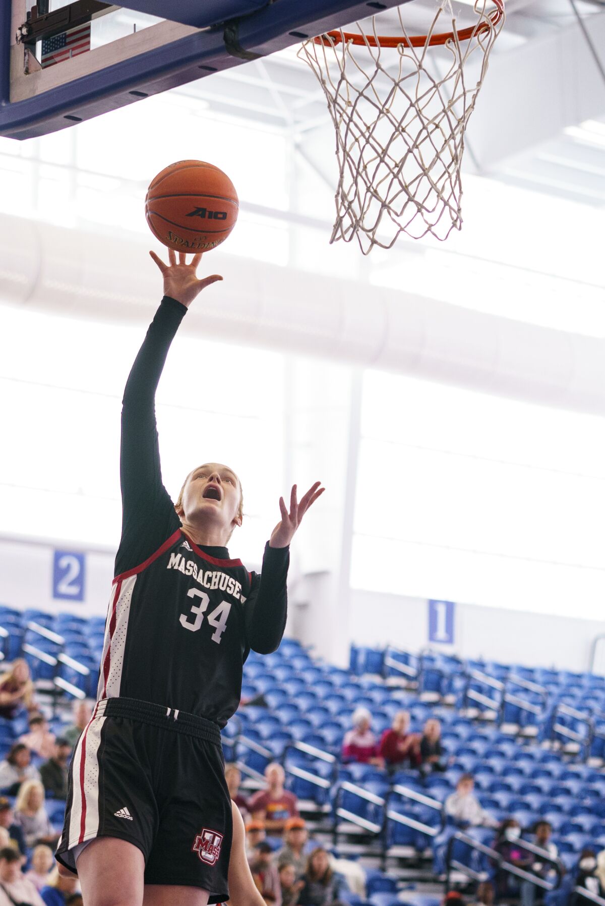 Massachusetts' Sam Breen shoots the ball during the first half of an NCAA college basketball championship game against Dayton in the A10 Conference Tournament, Sunday, March 6, 2022, in Wilmington, Del. (AP Photo/Chris Szagola)