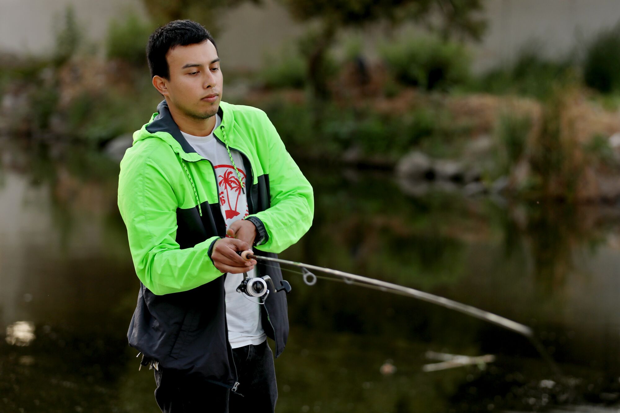 Edgar Alvarez fishes at the L.A. River.