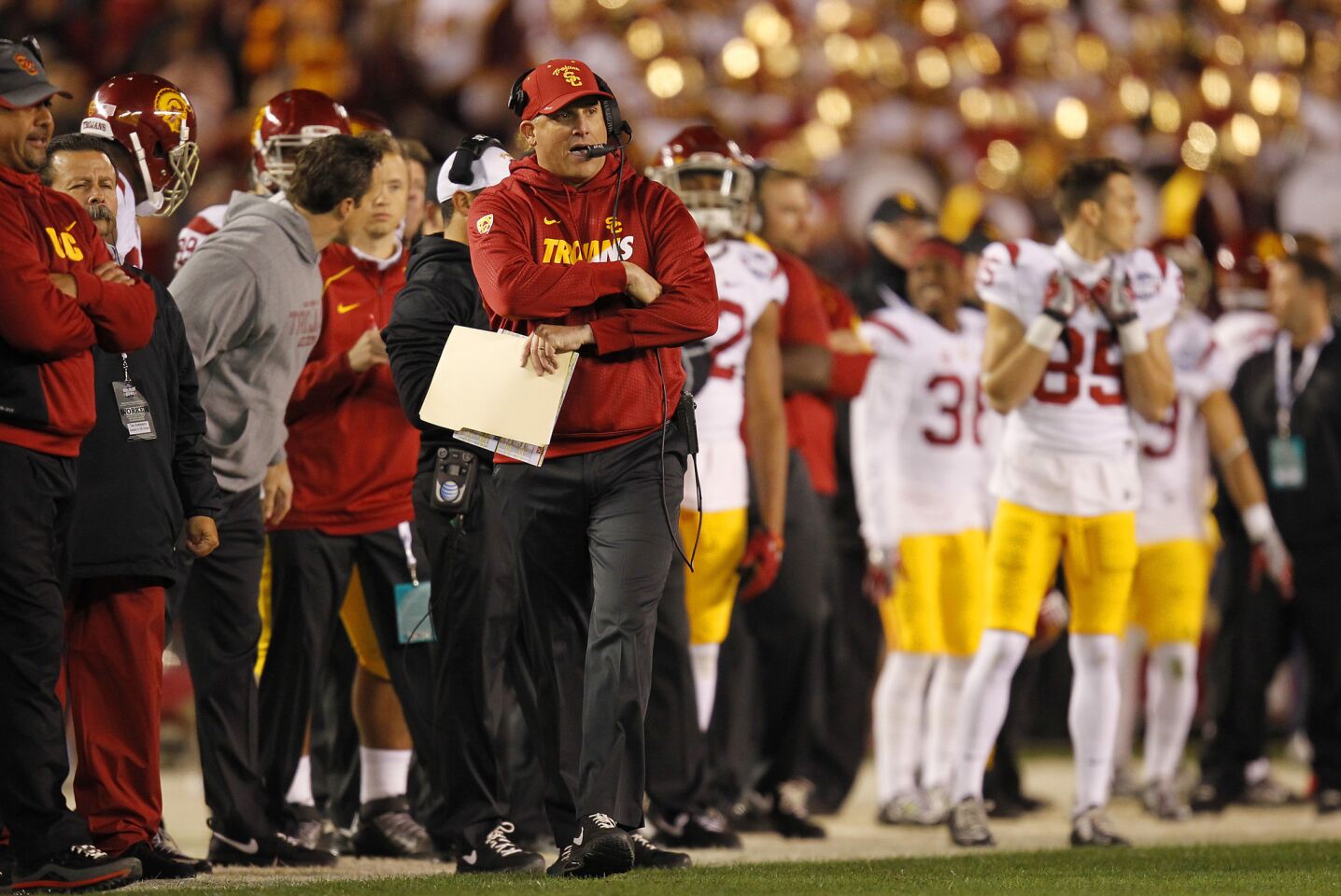 USC Coach Clay Helton walks the sideline during the loss to Wisconsin.