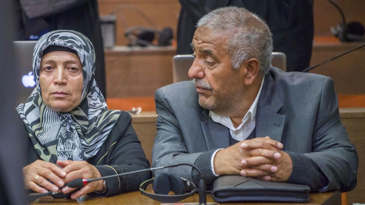 Ayse Yozgat, left, and Ismail Yozgat, whose son Halit Yozgat was killed by neo-Nazis, sit in court in Munich, Germany, on July 11.