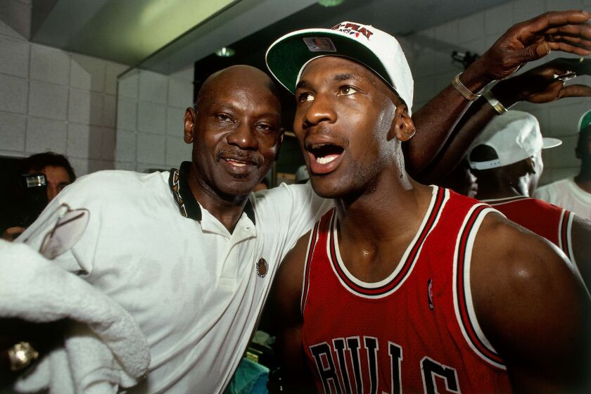 A photographed featured in "The Last Dance." PHOENIX - JUNE 20: Michael Jordan #23 of the Chicago Bulls celebrates winning the NBA Championship with his father after Game Six of the 1993 NBA Finals on June 20, 1993 at th America West Arena in Phoenix, Arizona. The Bulls won 99-98. NOTE TO USER: User expressly acknowledges and agrees that, by downloading and/or using this Photograph, user is consenting to the terms and conditions of the Getty Images License Agreement. Mandatory Copyright Notice: Copyright 1993 NBAE (Photo by Andrew D. Bernstein/NBAE via Getty Images)