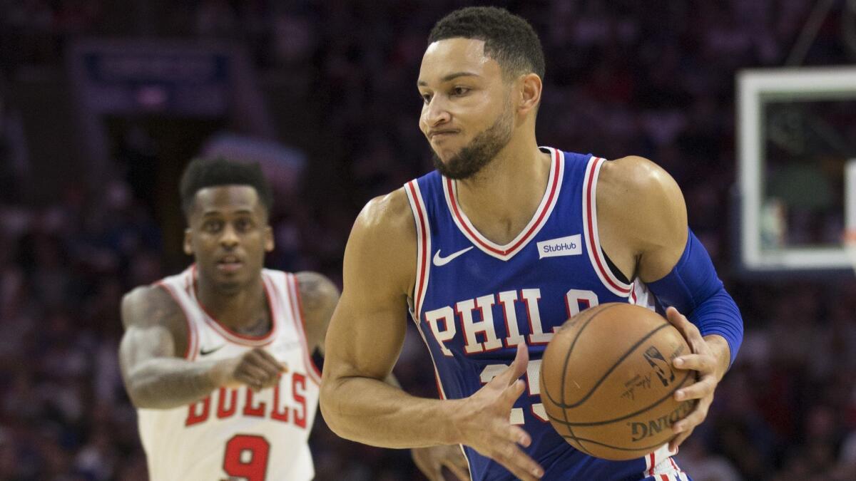 Ben Simmons of the Philadelphia 76ers drives to the basket against Antonio Blakeney of the Chicago Bulls in the first quarter.