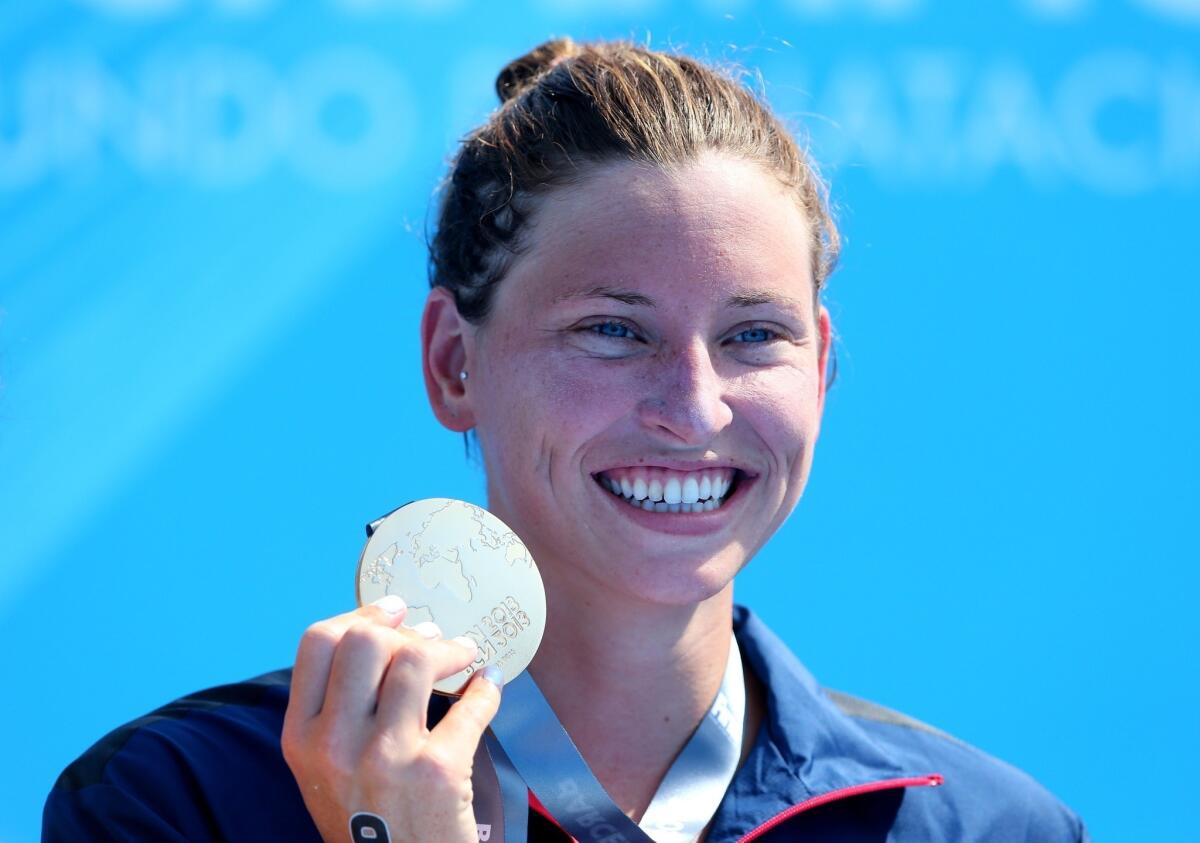 USC graduate Haley Anderson won the women's 5K at the world swimming championships Saturday in Barcelona, Spain.