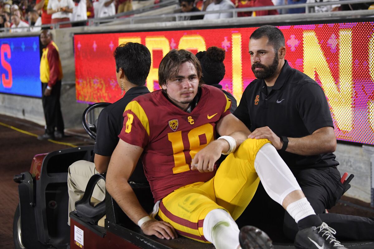 USC quarterback JT Daniels is carted off the field after suffering a torn ACL.