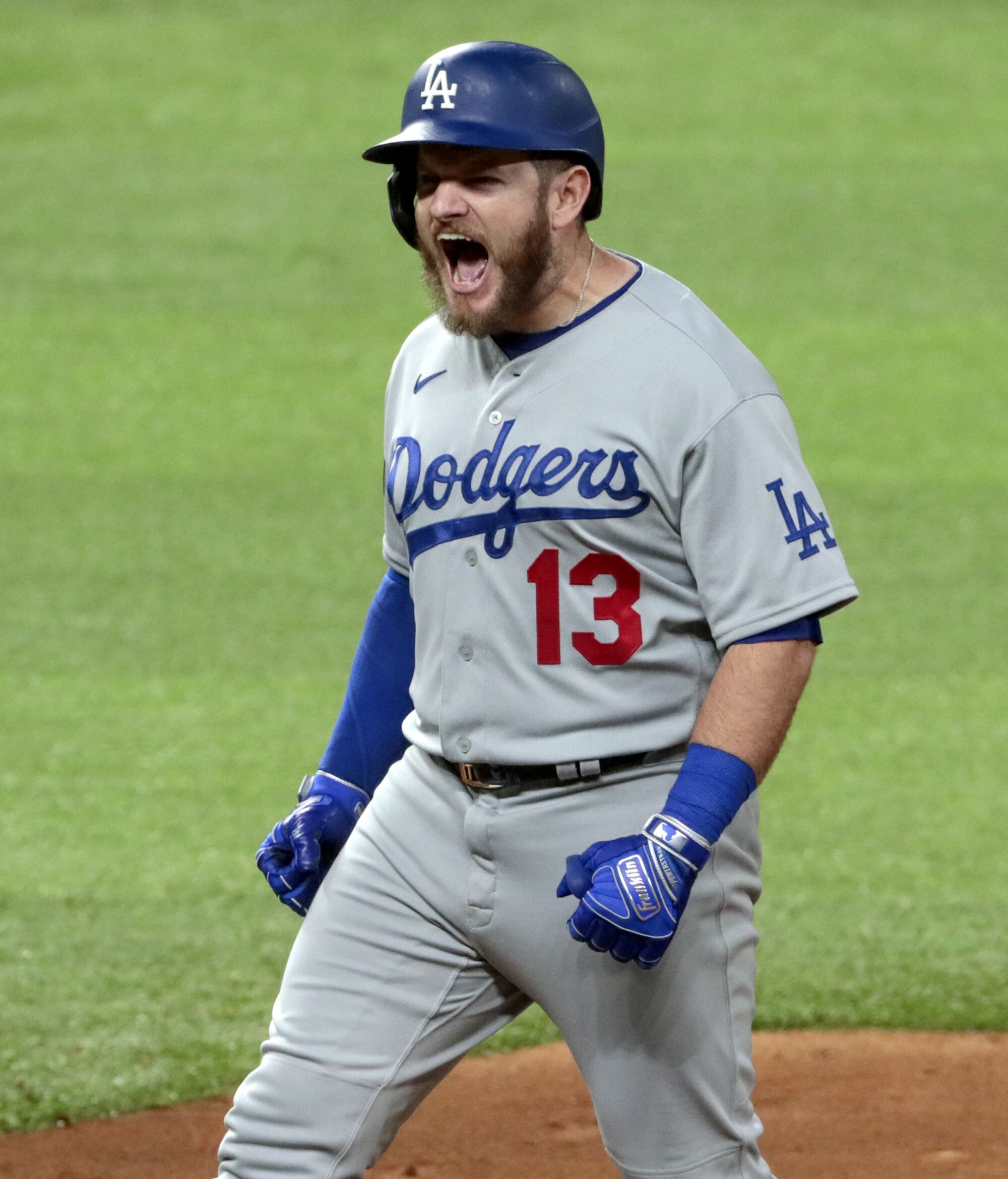 Dodgers first baseman Max Muncy celebrates after hitting a two-run single in the third inning.