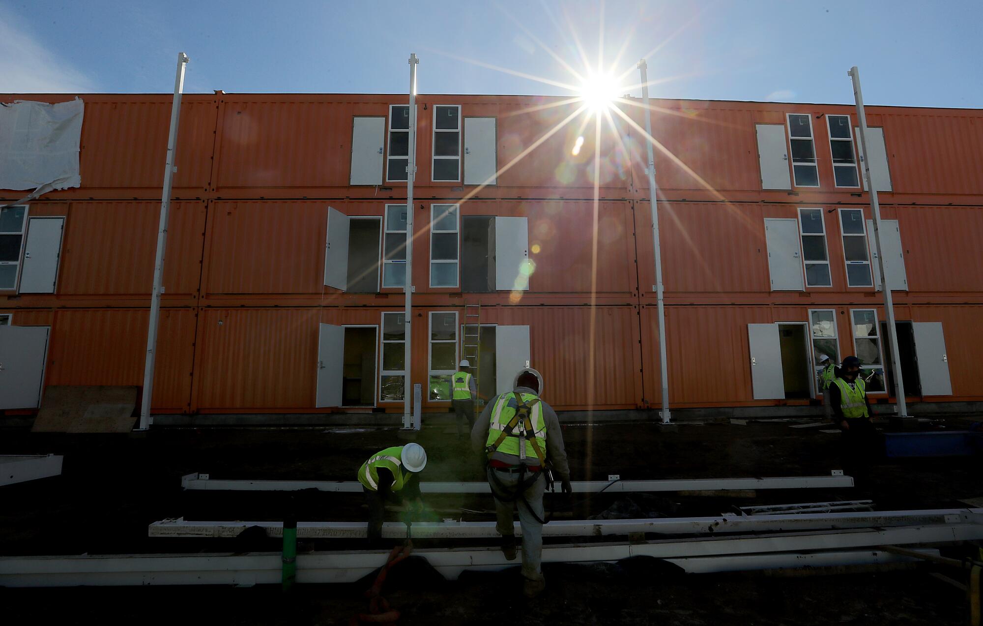 Contractors are rushing to complete a 232-unit homeless housing project in L.A.