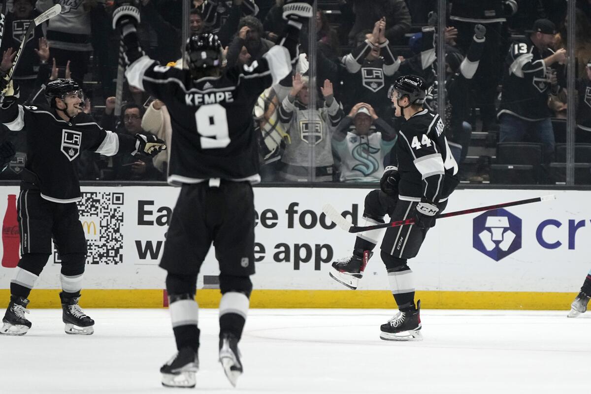 Kings defenseman Mikey Anderson celebrates his goal with left wing Kevin Fiala and right wing Adrian Kempe.