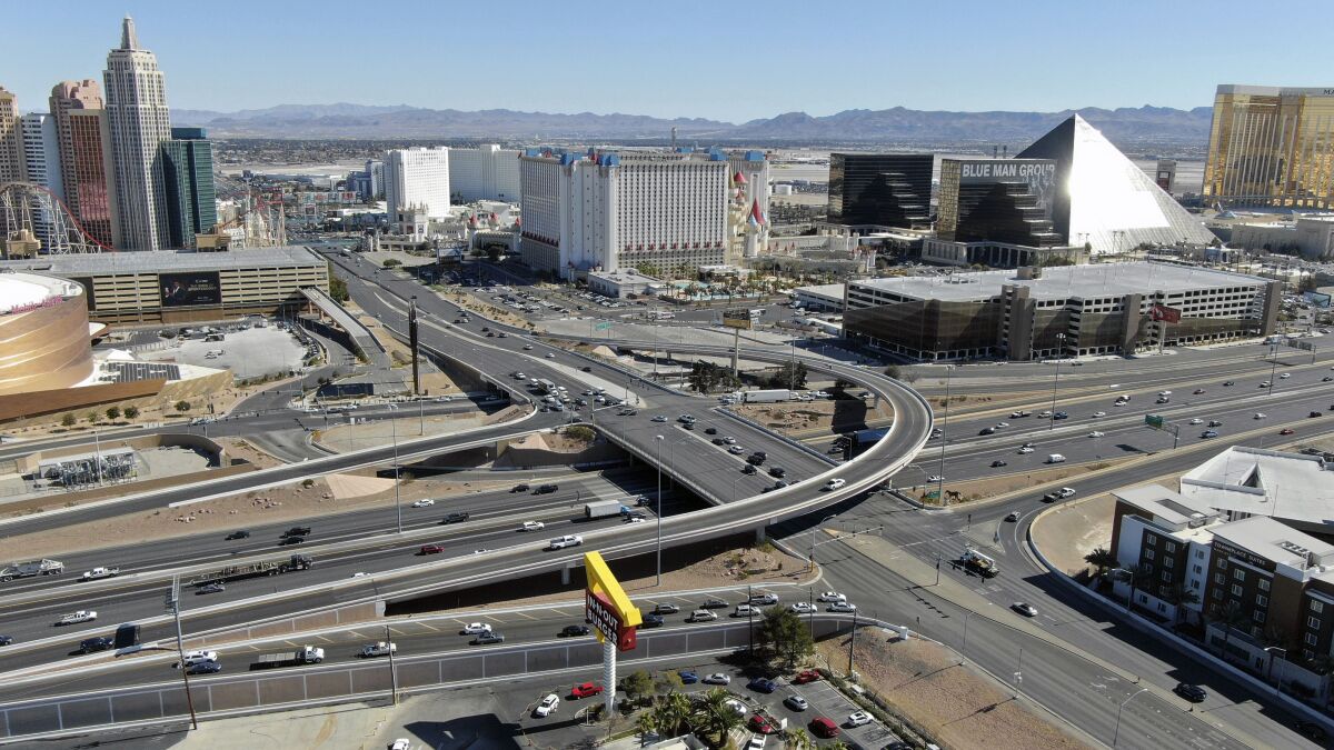 FILE - An aerial view of the interchange at Tropicana Avenue and Interstate 15 in Las Vegas, Tuesday, Feb. 18, 2021. Officials in Nevada say a key stretch of the main freeway between Los Angeles and Salt Lake City will close late Friday, Jan. 27, 2023 until early Monday as part of a project to reshape a busy interchange serving the Las Vegas Strip. (Michael Quine/Las Vegas Review-Journal via AP, File)
