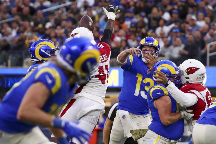 Los Angeles, CA - November 13: Cardinals outside linebacker Myjai Sanders deflects a pass by Rams backup.