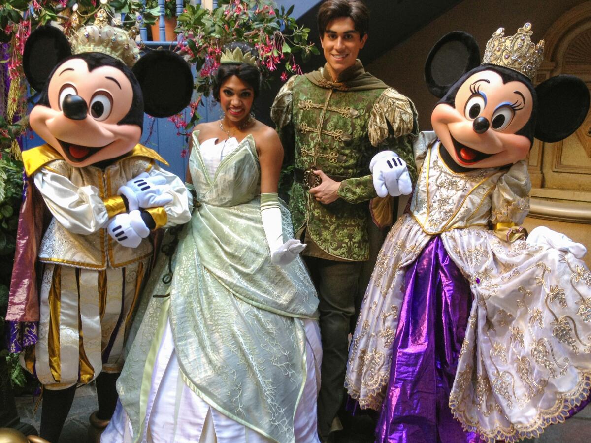 Stephanie Fish, center, as Princess Tiana with Mickey and Minnie and another "royal" in 2009.
