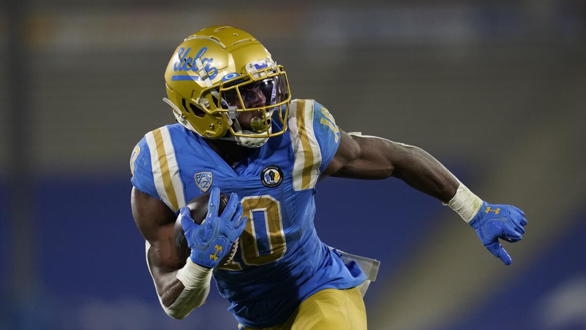 UCLA running back Demetric Felton (10) runs to the end zone for a touchdown during the first half.