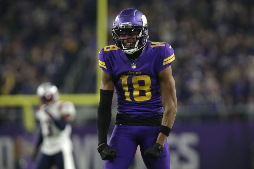Minnesota Vikings wide receiver Justin Jefferson celebrates after catching a pass during the second half of an NFL football game against the New England Patriots, Thursday, Nov. 24, 2022, in Minneapolis. (AP Photo/Andy Clayton-King)