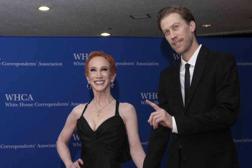  Comedian Kathy Griffin, and Randy Bick, smile while they arrive for the White House Correspondents' Association dinner