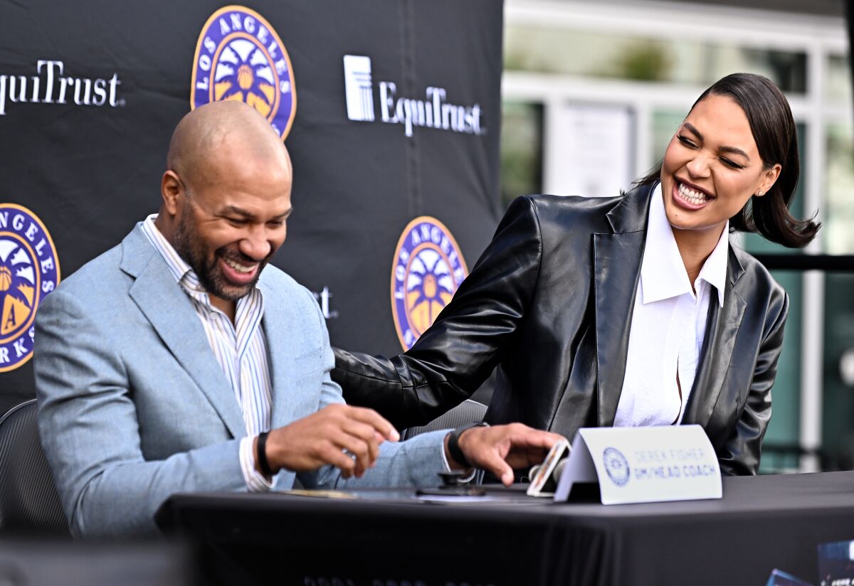 New Sparks player Liz Cambage and general manager and coach Derek Fischer answer questions at a news conference.