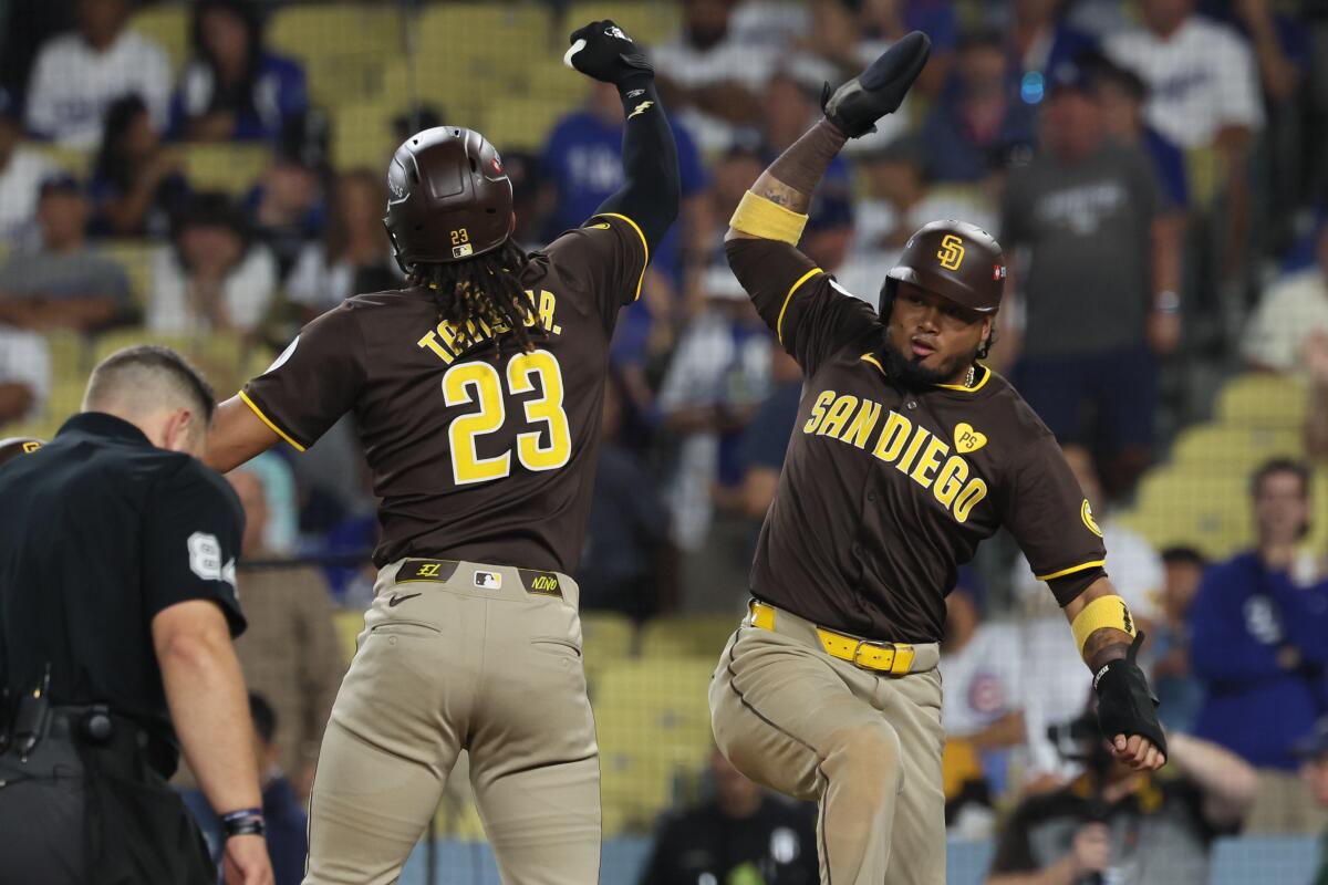 San Diego's Fernando Tatis Jr., left, celebrates with teammate Luis Arraez after hitting a two-run home run.