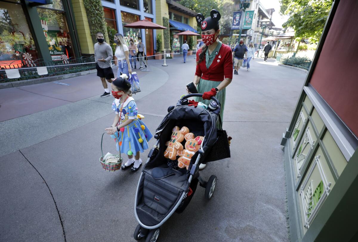 April Levar, daughter Ruth in Downtown Disney District, Nov. 19, the day Disney California Adventure partially reopened.