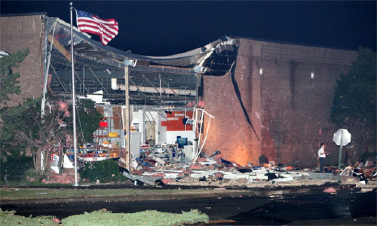 The collapsed wall of the appliance and television department at the Sears store in Hickory Ridge Mall at Ridgeway and Winchester is seen in Memphis, Tenn.