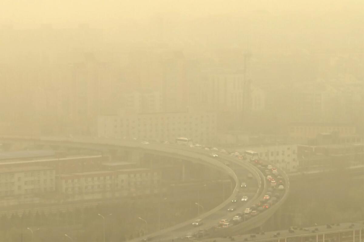 A highway pictured during a dust storm amid heavy pollution in Beijing.