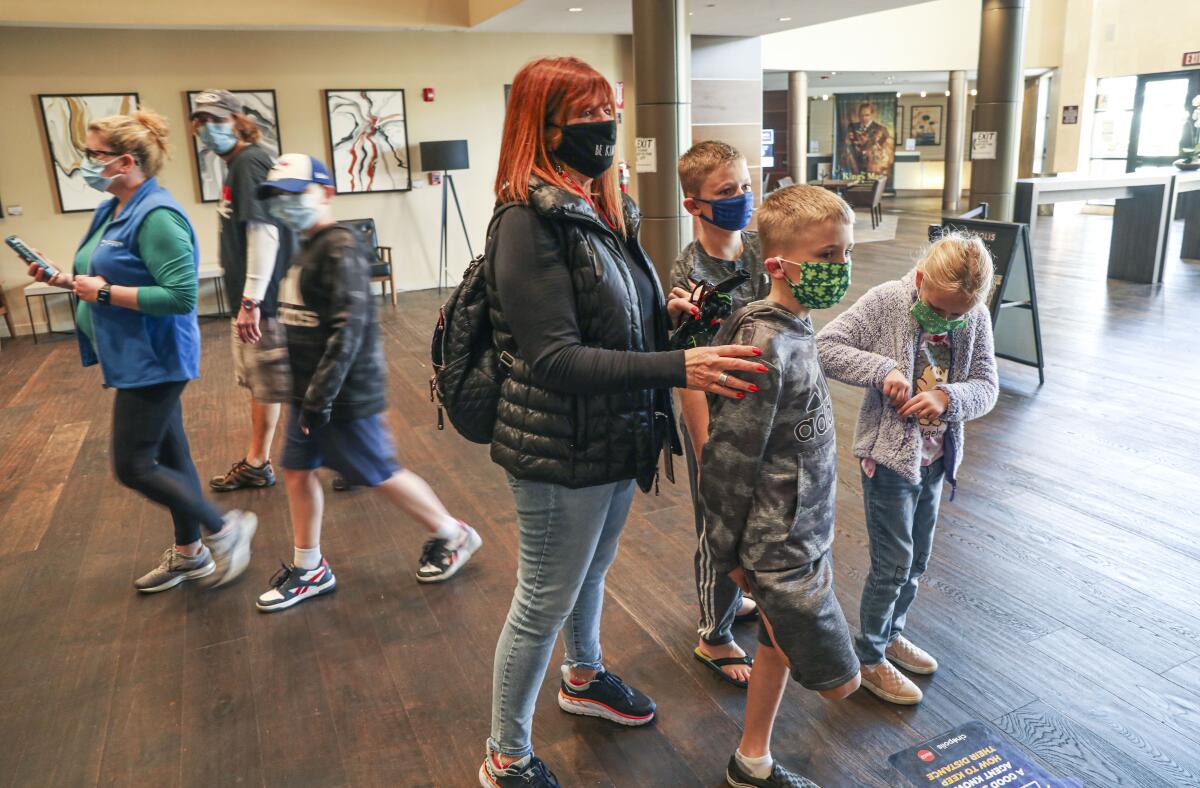 Iris Hirsh stands in line with her grandkids at Cinepolis Luxury Cinemas Del Mar