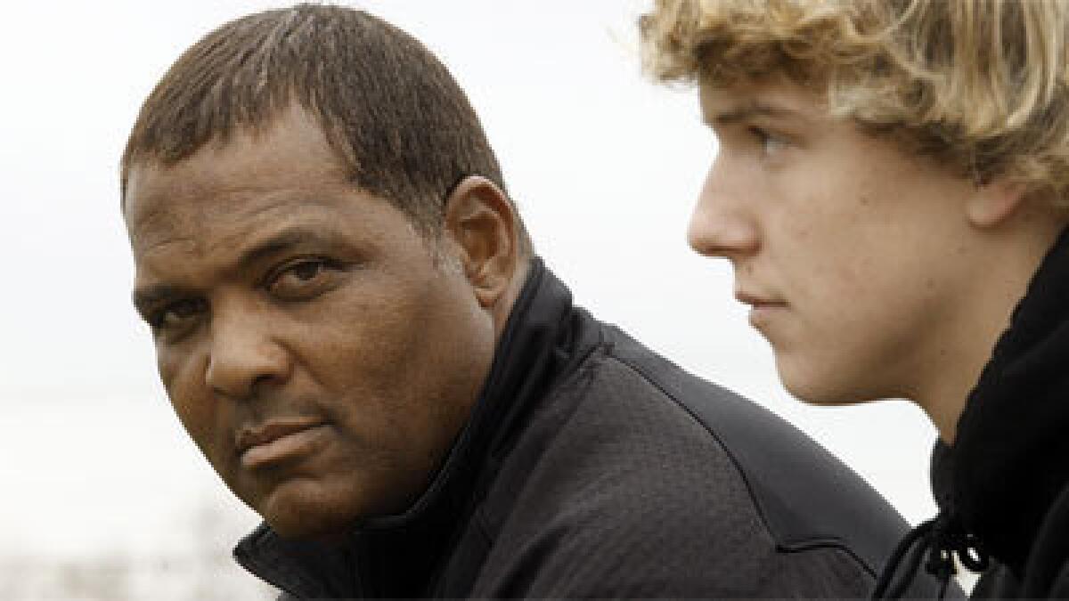 Private quarterbacks coach Steve Clarkson, shown in 2011 with client David Sills.