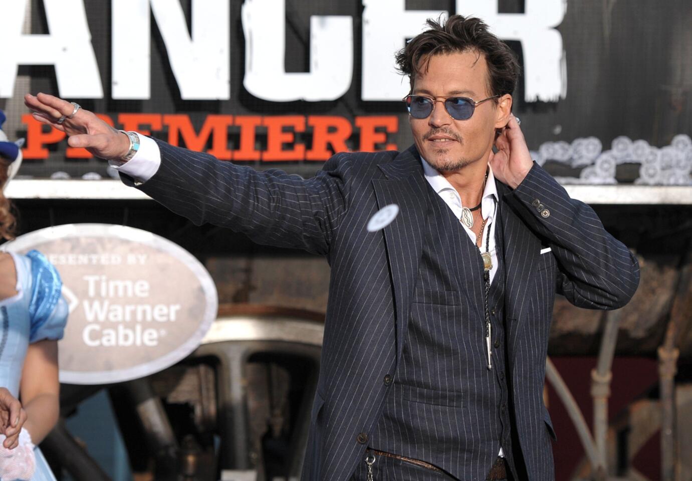 Johnny Depp appears on stage at the world premiere of "The Lone Ranger."