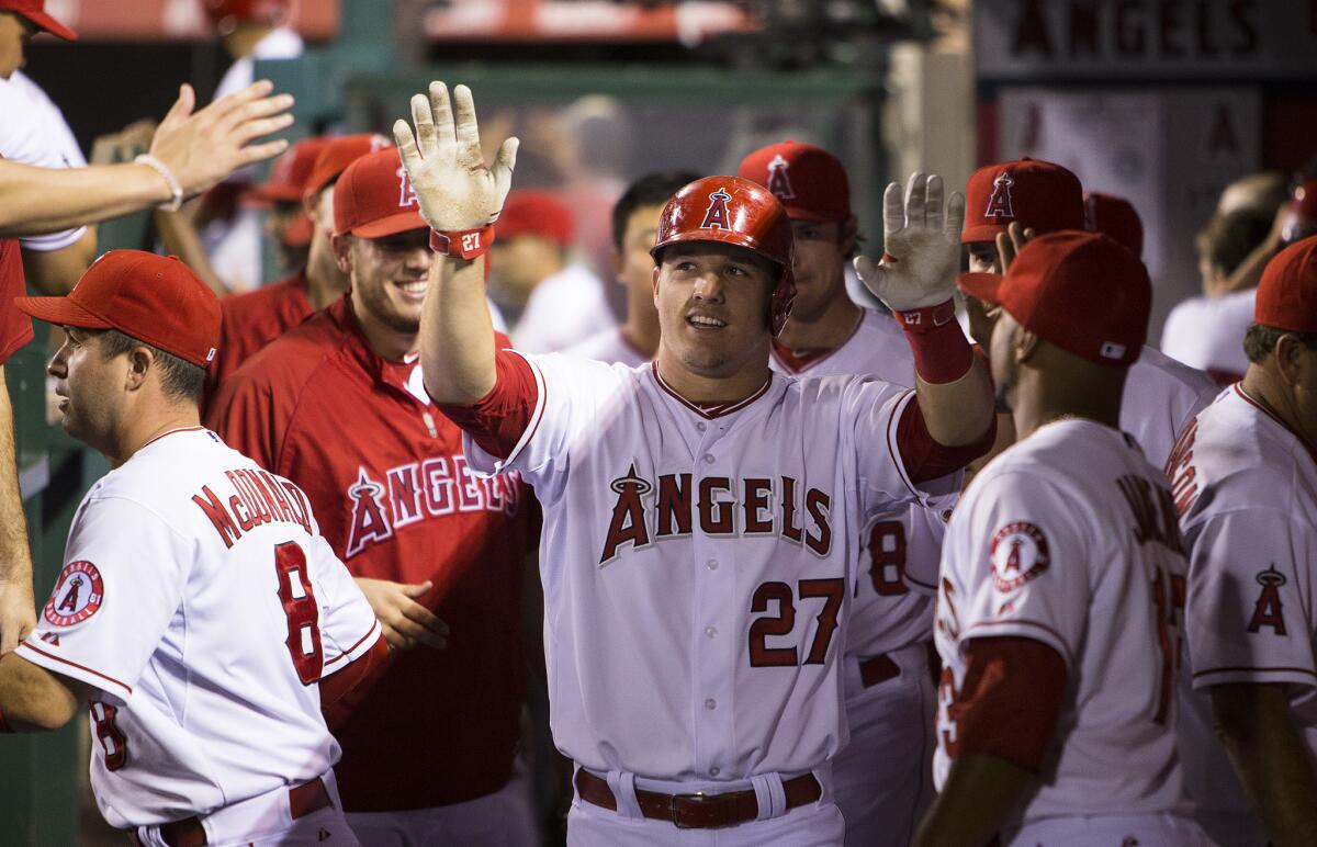 Not being nickel-and-dimed by Angels management: center fielder Mike Trout (27) collected a rich contract from the team. Stadium workers? Not so much.