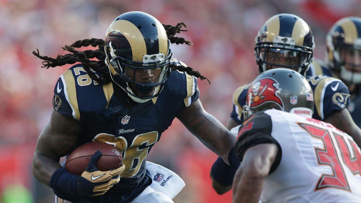 Rams linebacker Mark Barron secures an interception against the Tampa Bay Buccaneers on Sept. 25, 2016.