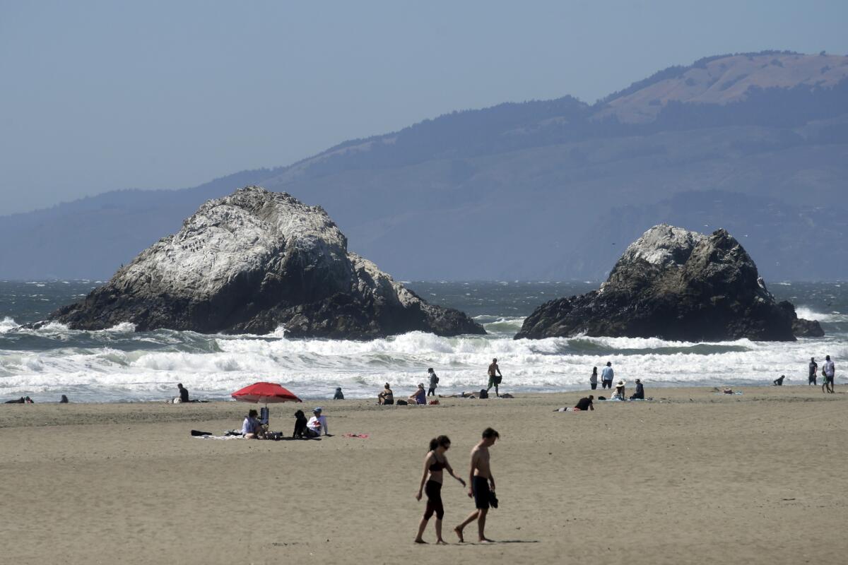 People visit Ocean Beach during the coronavirus outbreak in San Francisco