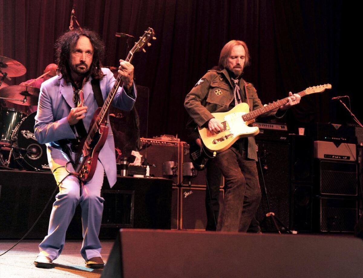 Tom Petty, right, and the Heartbreakers, with musician Mike Campbell perform at the Fonda on June 3, 2013.