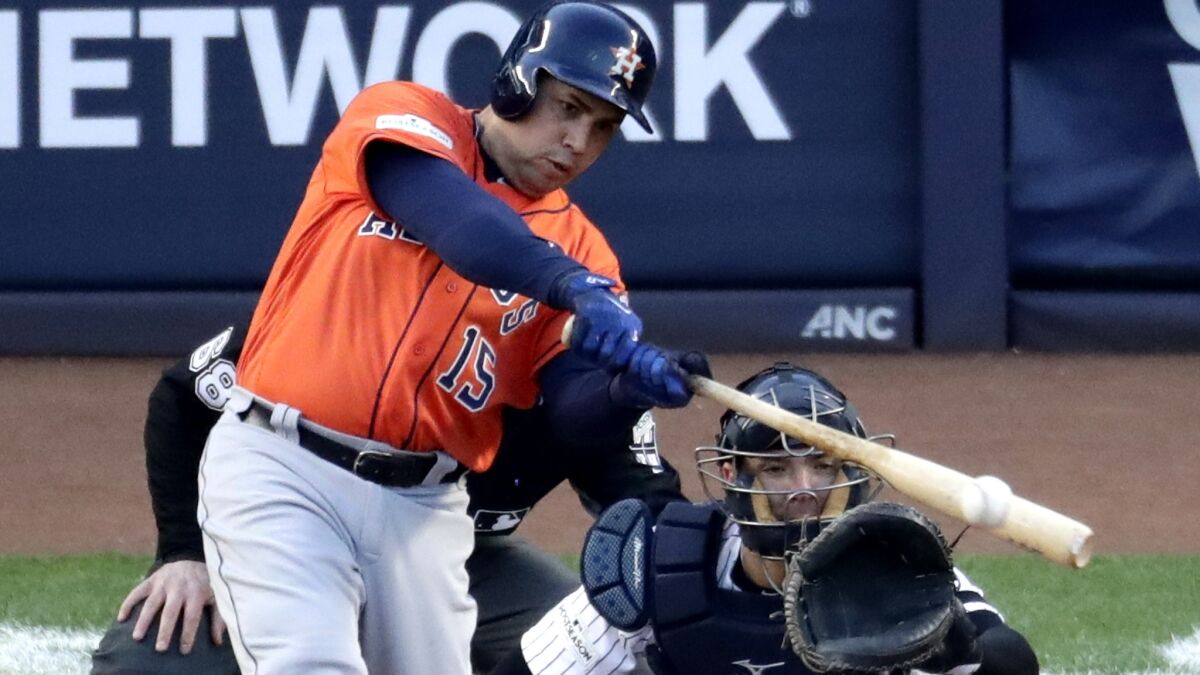 Astros slugger Carlos Beltran connects for a double against the Yankees during the second inning of Game 4.