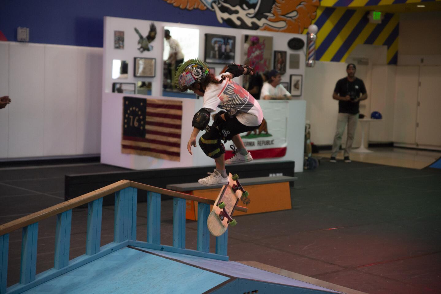 A young skater grinds a rail during an open skate session at United Collective's pop up skate park