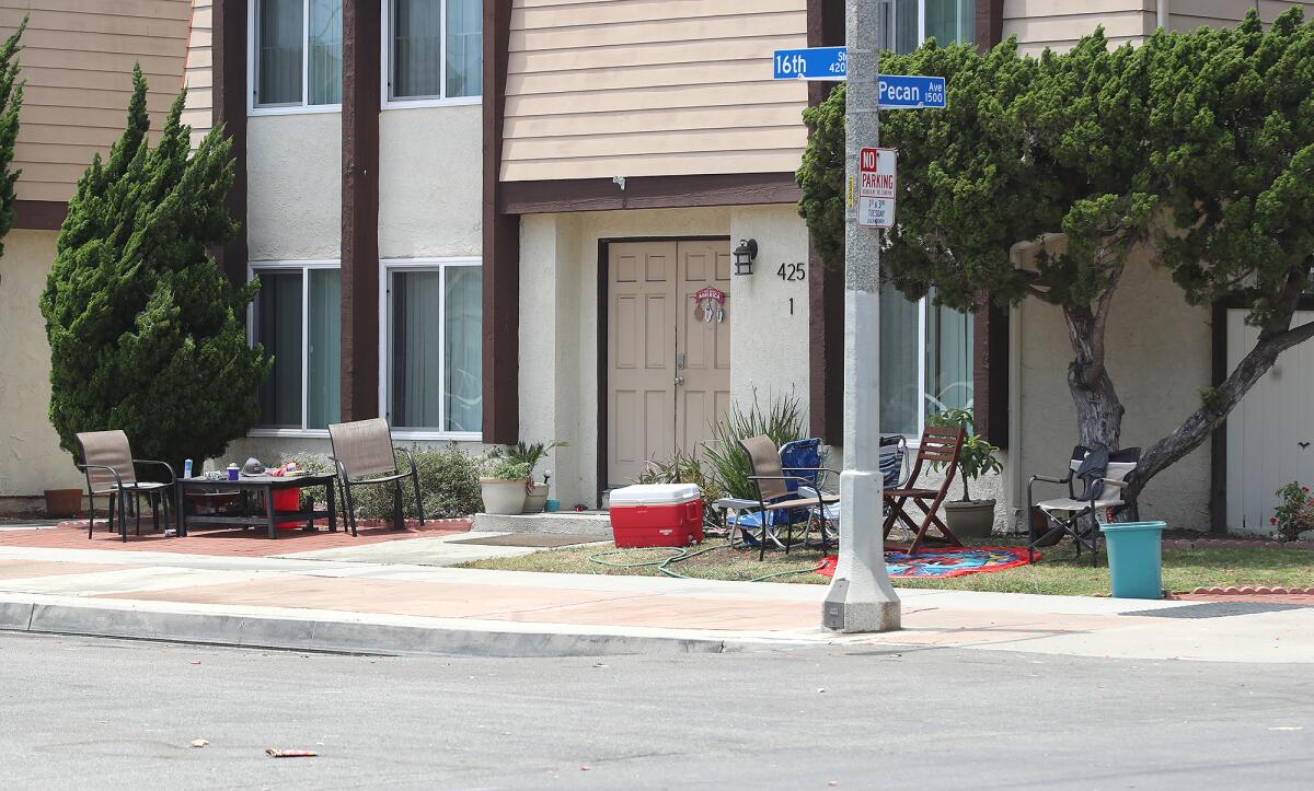 Beach chairs, a cooler, and tables rest at the corner of 16th Street and Pecan Avenue.