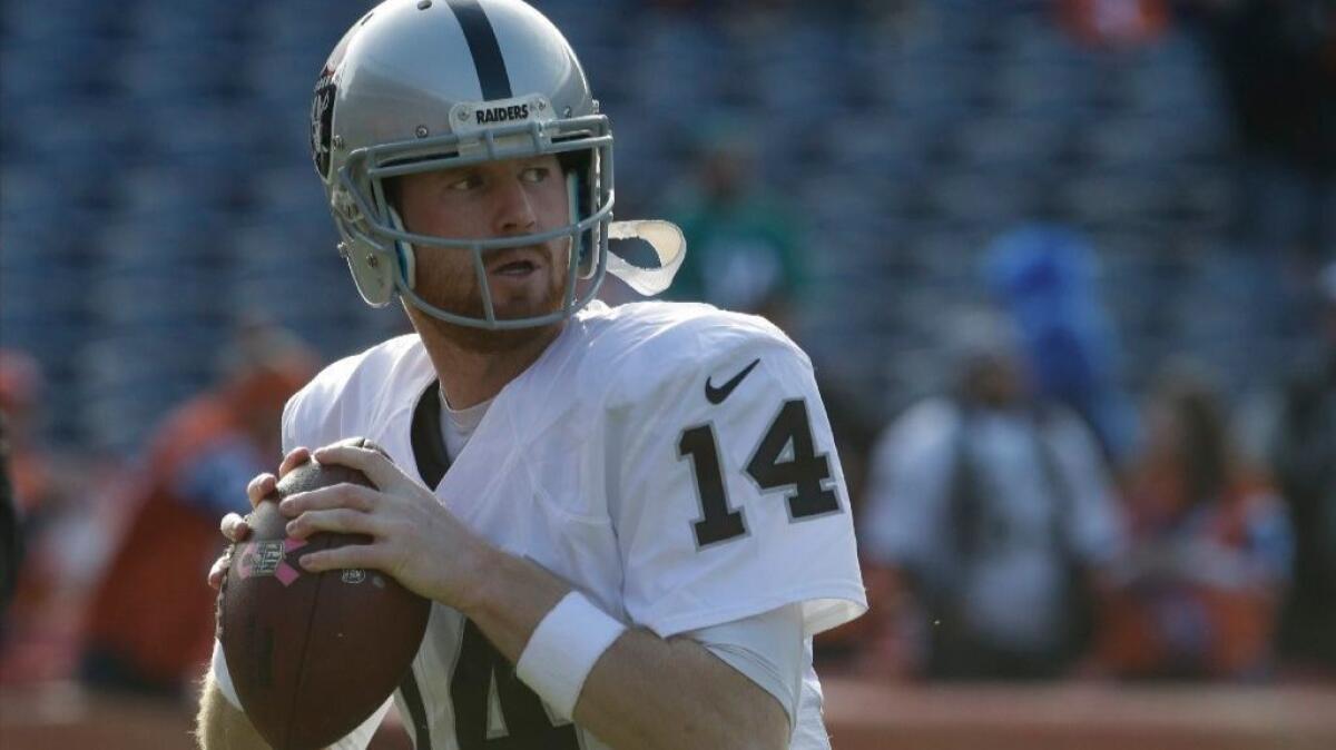 Raiders quarterback Matt McGloin passes during warmups before a game against the Broncos on Jan. 1.