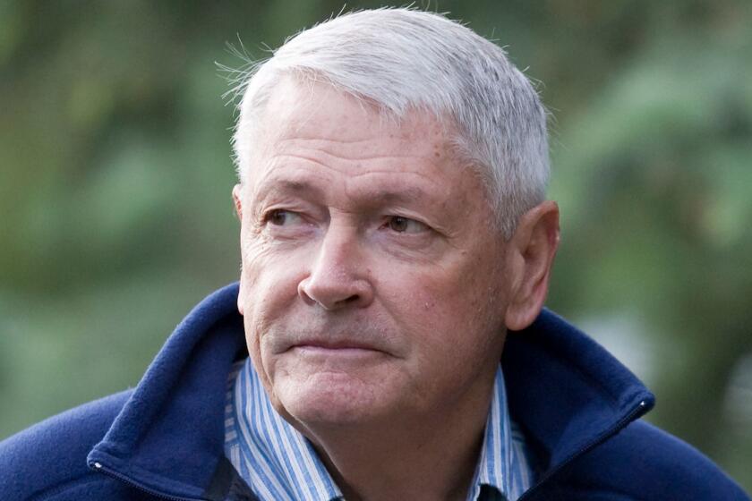 John Malone, Chairman of Liberty Media and CEO of Discovery Holding Company, walks to a morning session at the annual Allen & Co.'s media summit in Sun Valley, Idaho, Friday, July 10, 2009.(AP Photo/Nati Harnik)