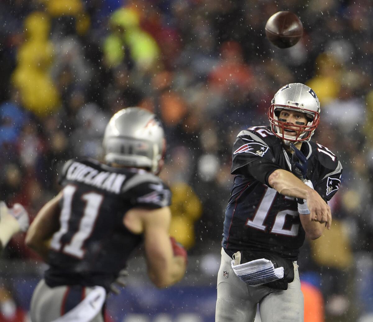 Patriots quarterback Tom Brady throws a pass to receiver Julian Edelman during the AFC Championship game against the Indianapolis Colts on Jan. 18.