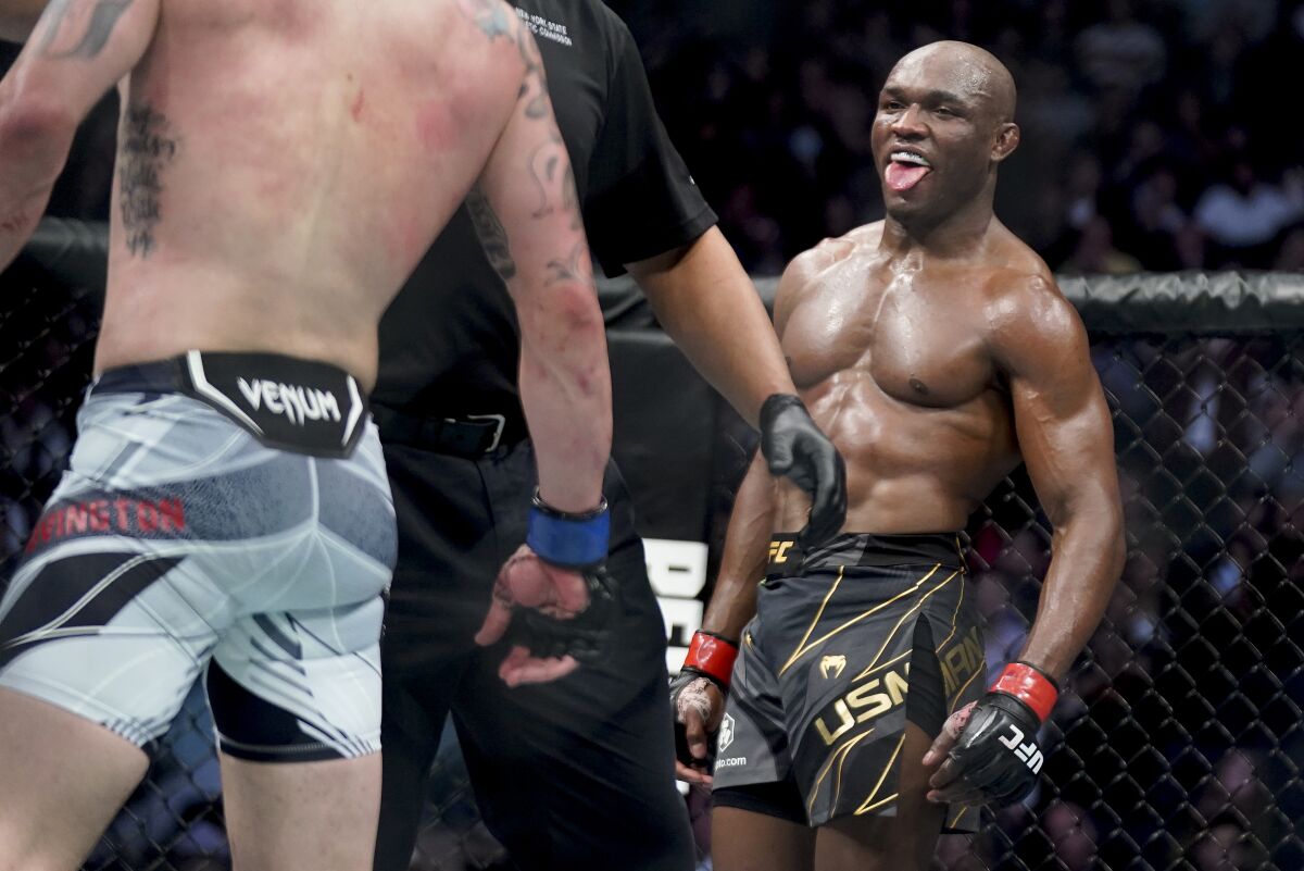 Kamaru Usman reacts against Colby Covington during a welterweight mixed martial arts championship bout at UFC 268, Sunday, Nov. 7, 2021, in New York. (AP Photo/Corey Sipkin)