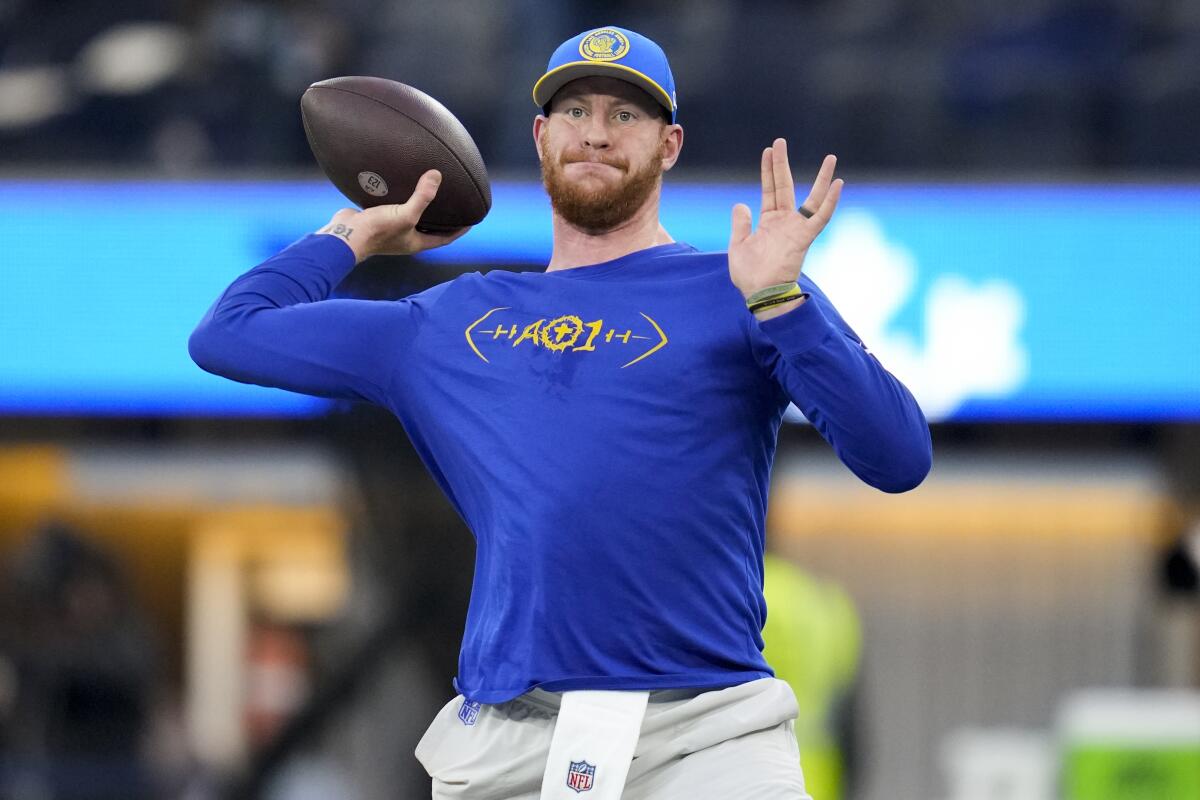 Rams quarterback Carson Wentz warms up before a game against the New Orleans Saints.
