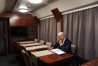 FILE - President Joe Biden sits on a train as he goes over his speech marking the one-year anniversary of the war in Ukraine after a surprise visit with Ukrainian President Volodymyr Zelenskyy, Monday, Feb. 20, 2023, in Kyiv. More Americans think foreign policy should be a top focus for the U.S. government in 2024 amid ongoing wars in the Gaza Strip and Ukraine, with a new poll showing overseas concerns and immigration rising in importance, even as they’re overshadowed by long-standing economic worries. (AP Photo/ Evan Vucci, Pool, File)