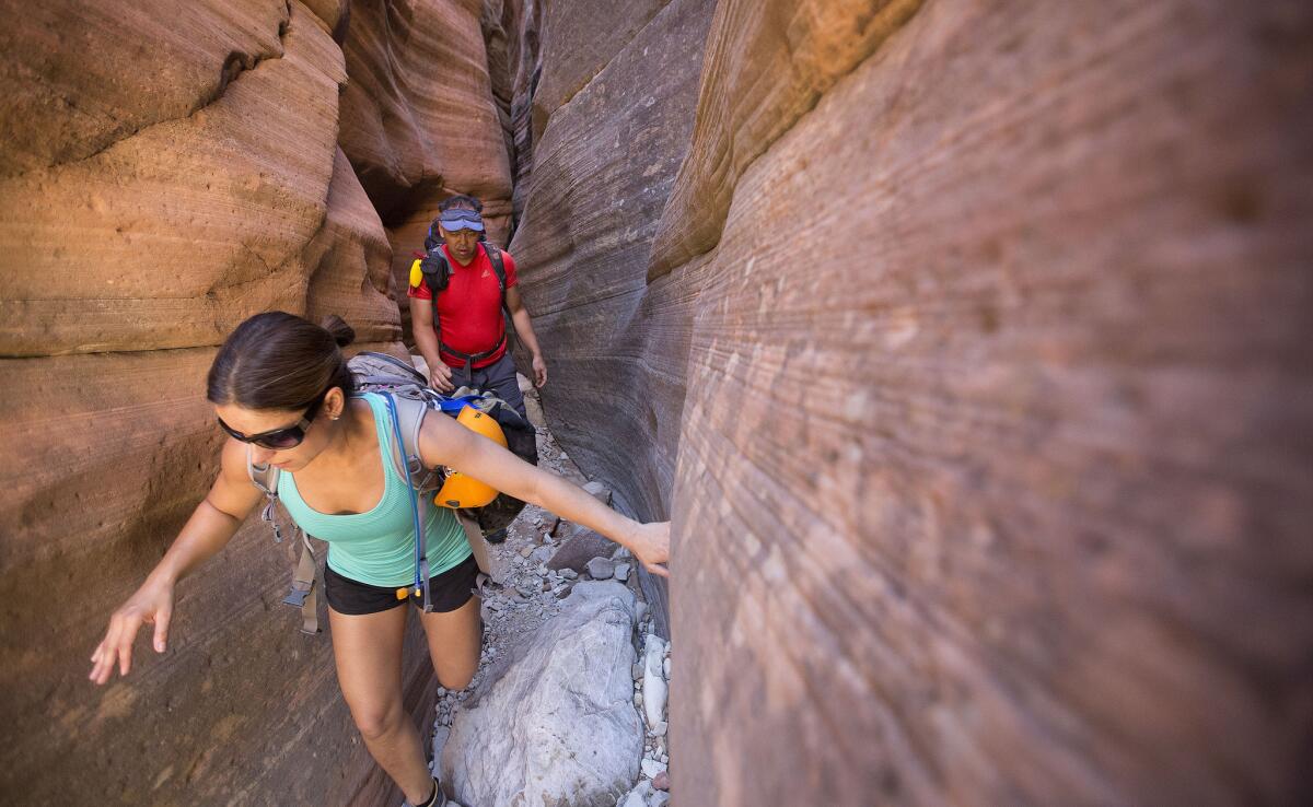 Ray Regalado and Marcela Prado explore Keyhole Canyon in Zion National Park, Utah, on Sept. 19, 2015. Days earlier, seven canyoneers there were swept away to their deaths by a flash flood.
