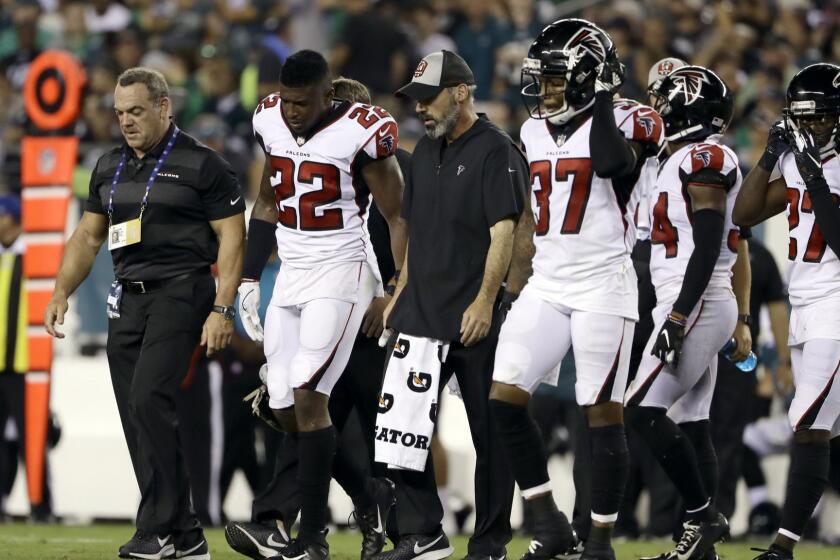 Atlanta Falcons' Keanu Neal (22) is helped off the field during the second half of an NFL football game against the Philadelphia Eagles, Thursday, Sept. 6, 2018, in Philadelphia. (AP Photo/Matt Rourke)