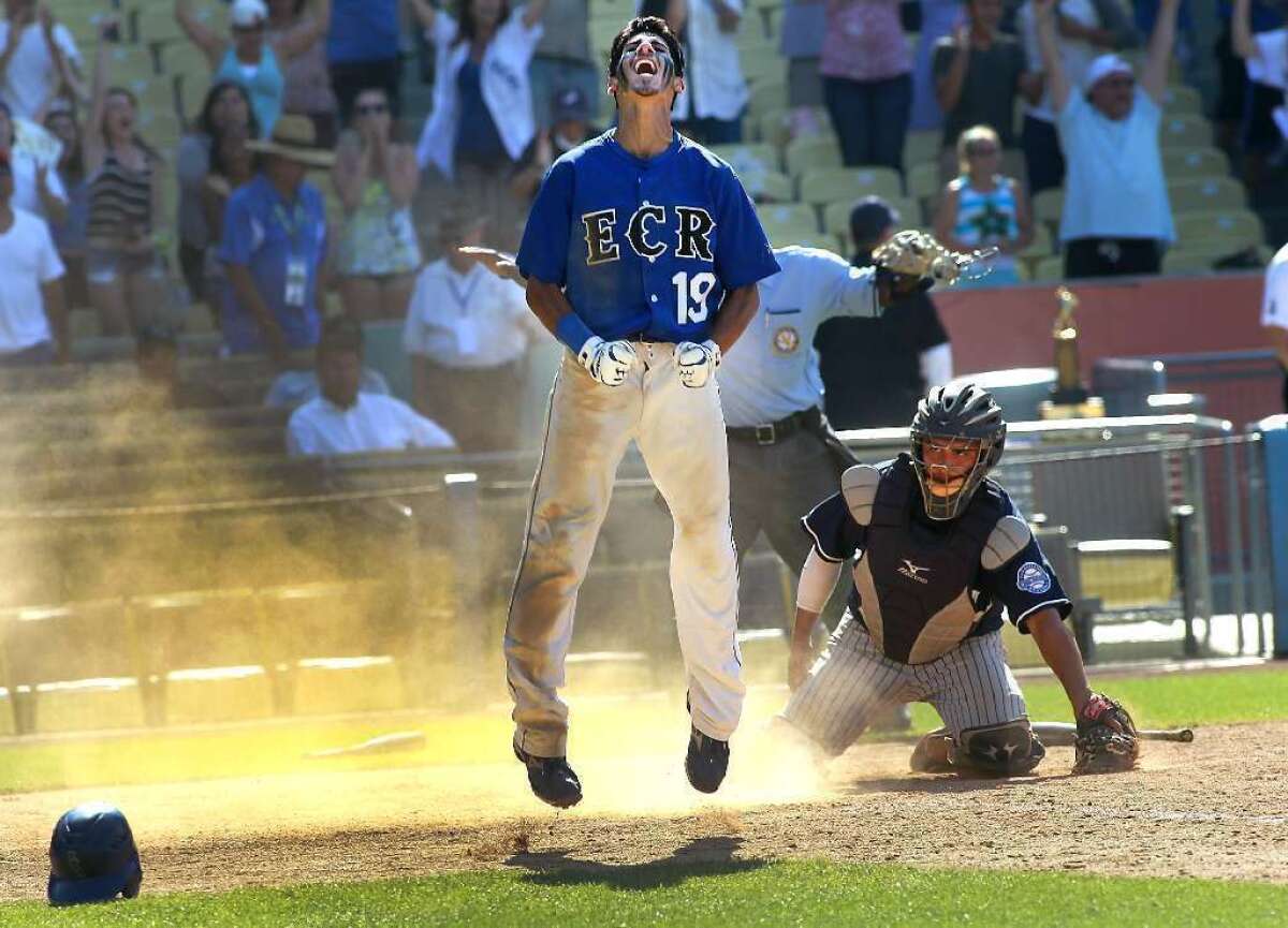 El Camino Real's Mitchell Dergazarian celebrates after scoring in the bottom of the ninth to defeat Chatsworth in the City baseball final last year at Dodger Stadium.