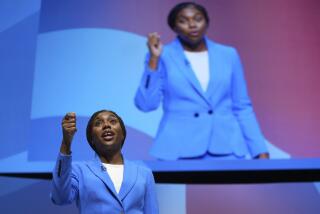 Conservative leadership candidate Kemi Badenoch addresses members during the Conservative Party Conference at the International Convention Centre in Birmingham, England, Wednesday, Oct. 2, 2024.(AP Photo/Kin Cheung)