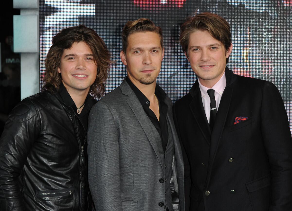 From left, brothers Zac Hanson, Isaac Hanson and Taylor Hanson of the band Hanson are shown in 2013 in London.