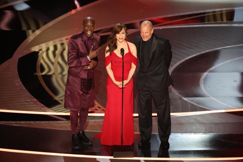 HOLLYWOOD, CA - March 27, 2022. Wesley Snipes, Rosie Perez, and Woody Harrelson during the show at the 94th Academy Awards at the Dolby Theatre at Ovation Hollywood on Sunday, March 27, 2022. (Myung Chun / Los Angeles Times)