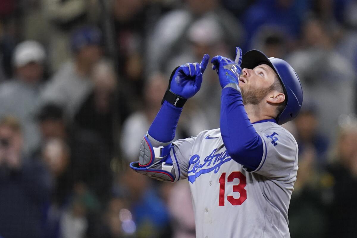 The Dodgers' Max Muncy gestures after hitting a home run during the fifth inning Friday.