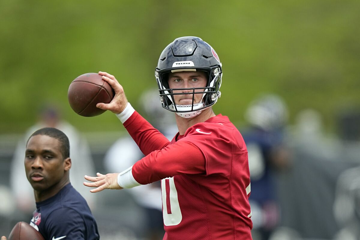 FILE - Houston Texans quarterback Davis Mills throws a pass during a voluntary NFL football minicamp practice Tuesday, April 26, 2022, in Houston. The Texans look to Davis Mills as their answer at quarterback after finally moving on from Deshaun Watson in a trade to Cleveland this offseason.(AP Photo/David J. Phillip, FIle)